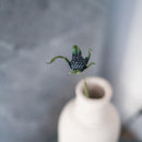 Panicaut thistle in turquoise blue paper